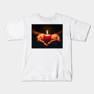 Small red candle burning held in hands on black background generative ai Kids T-Shirt